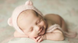 Windsor, Colorado Newborn Baby Photographer Smiling bear bonnet photo